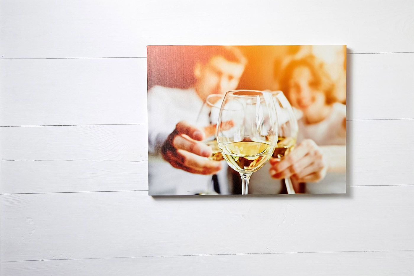 Canvas of couple clanking champagne glasses